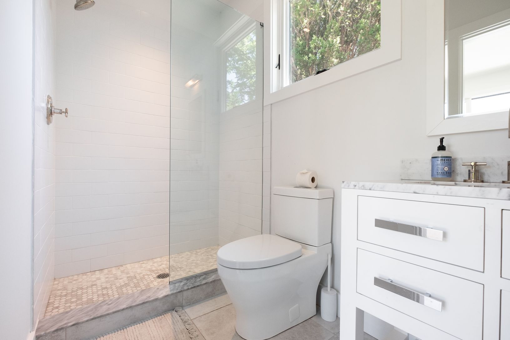 Pool house bathroom with shower stall