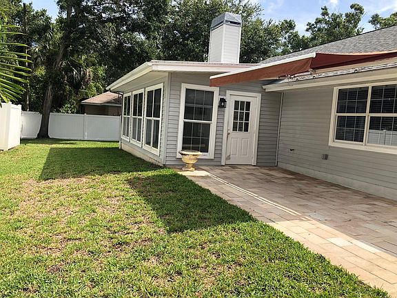 Retractable Awning Patio and Fenced Backyard