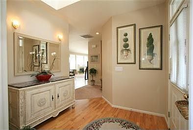 The entry opens to the den/office and opens to the dining, kitchen and living 