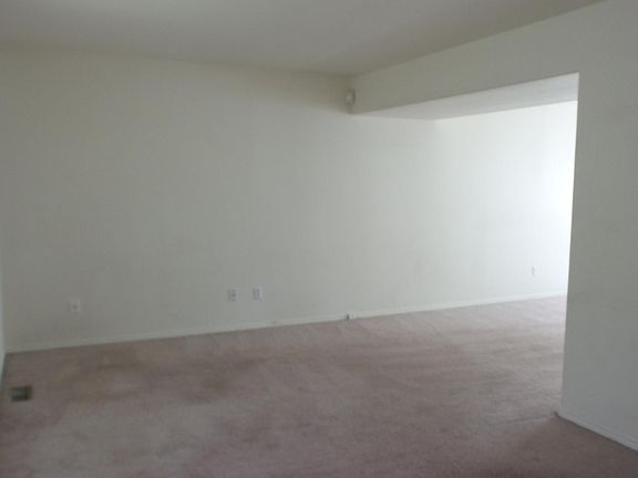 Formal living room, the windows on left are the front of the house.