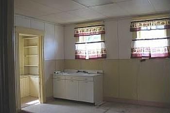 Another view of the kitchen, this is a large spacious room ready to for new cabinets, notice the doo