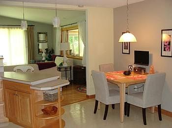 The kitchen eating area looking into the living room