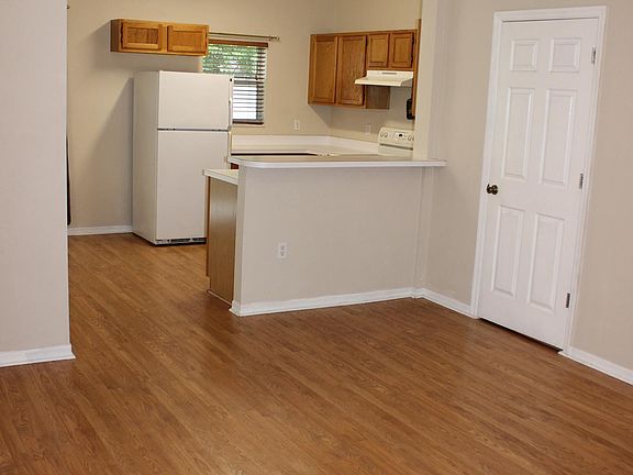 Breakfast bar can accommodate 2 stools. Half bath door on right.