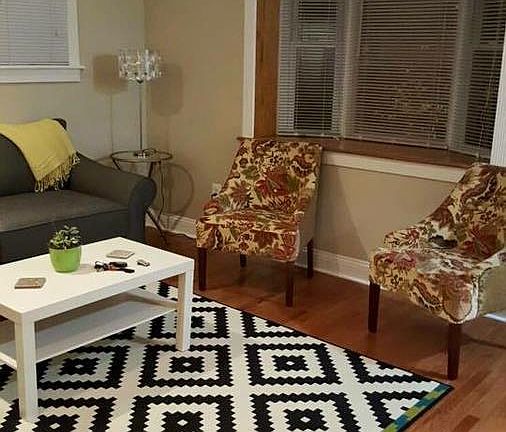 Living room features vaulted ceilings
