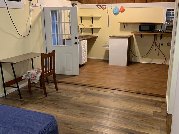 View from near walk in closet. New wall A/C, desk and chair