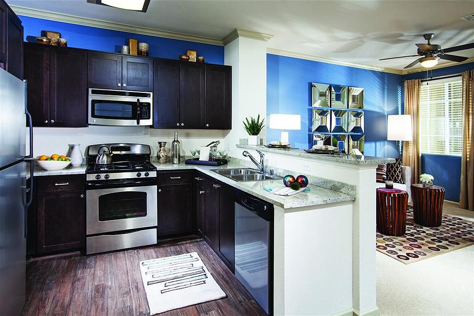 Espresso cabinets and stainless steel appliances give your kitchen a modern feel