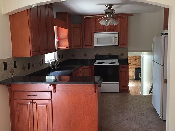 Dining area leads to kitchen and stairs to familly room