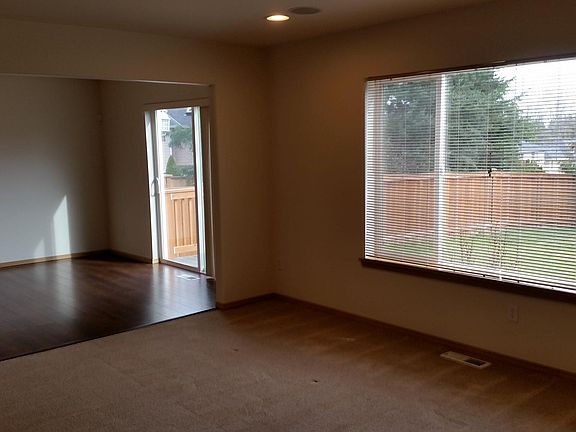 Living room top dining room and back yard