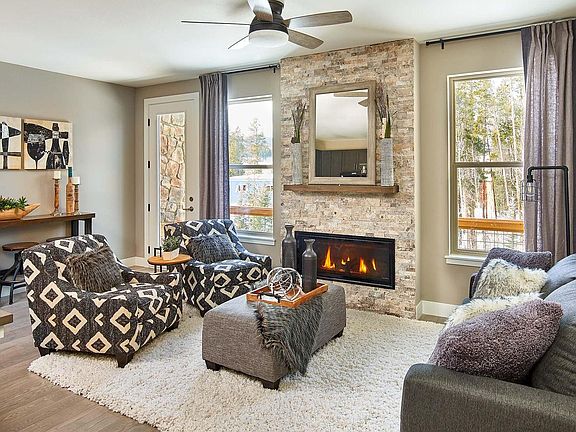 The great room has a modern fireplace