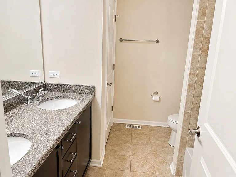 Second-floor bathroom _ view of the toilet area and linen closet.