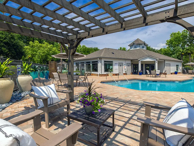Relax under the poolside pergola for the best seat in the house.
