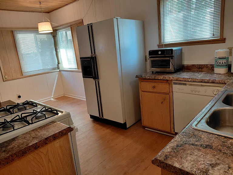 Spacious kitchen with dining nook and abundant natural light.