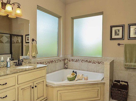 Large bathroom with corner tub