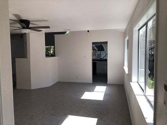 The front door entrance is a happy, welcoming, light-filled room that may show off a beautiful Christmas tree, a piano, or simply a welcoming party with room full of happy friends and family!