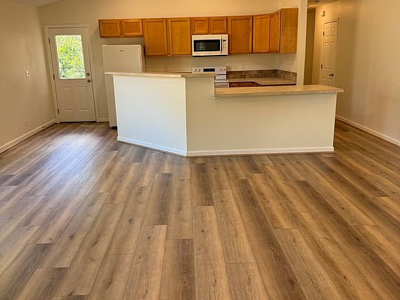 Enjoy an open-concept layout that seamlessly connects the living room and kitchen_perfect for entertaining, family time, and everyday living. Fresh paint, LVP flooring, and natural light make the space warm and inviting.