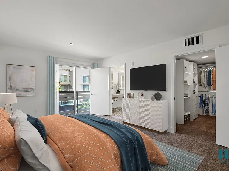 Bedroom with Walk-In Closet with Built-In Organizers, Bathroom, and Balcony
