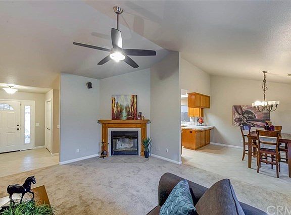 Large family room with fireplace and cathedral ceilings.