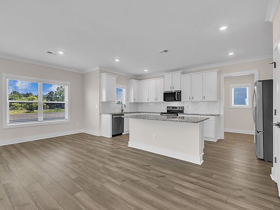 The kitchen has a spacious kitchen island.