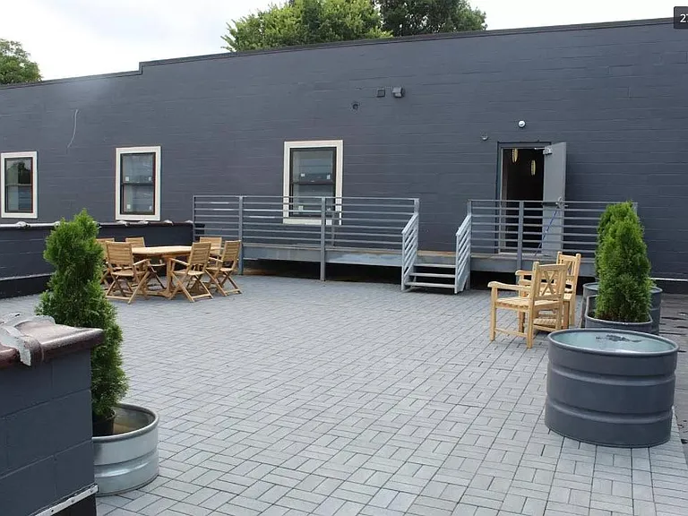 Rooftop terrace with teak furniture and fire pit