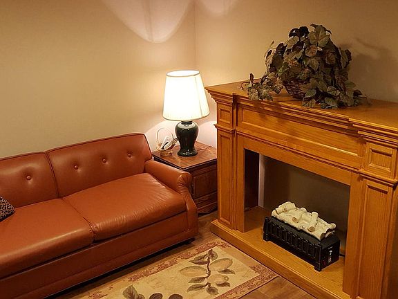 Electric fireplace with supplemental heater