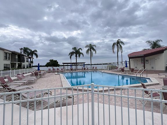 Community pool and hot tub overlooking the bay
