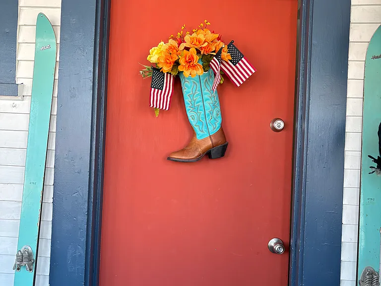 Front door in enclosed porch.