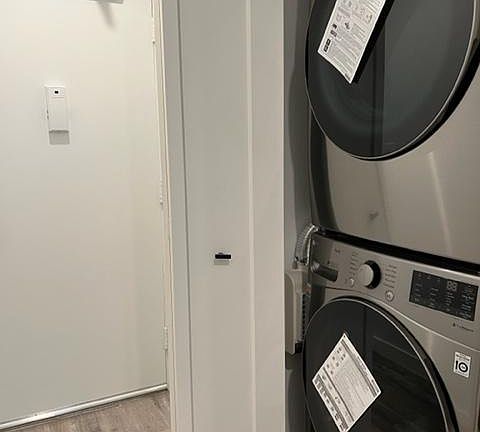 As you walk through the front door, the full-sized washer/dryer is located in the entryway.