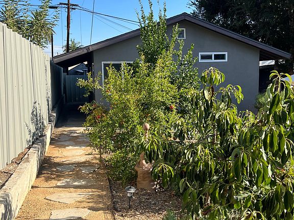A private entrance leads through the garden along a dedicated path to the cottage.