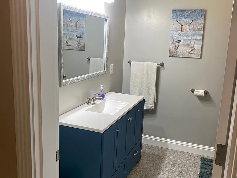 Guest Bathroom with granite flooring.