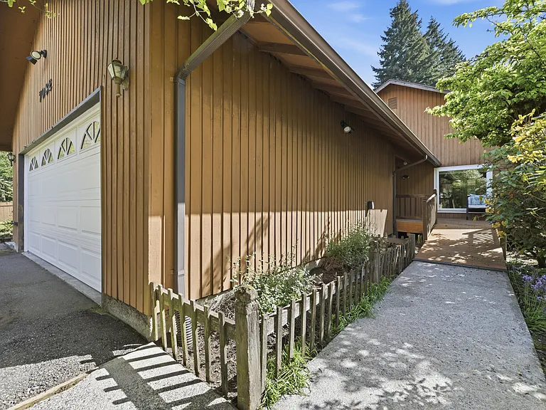 Attached 2-car garage with extra driveway and RV parking