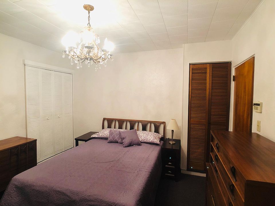 Front bedroom with queen-sized Tuft and Needle mattress (a Top-Notch Consumer Reports Mattress). There are two closets, two nightstands, and two dressers.