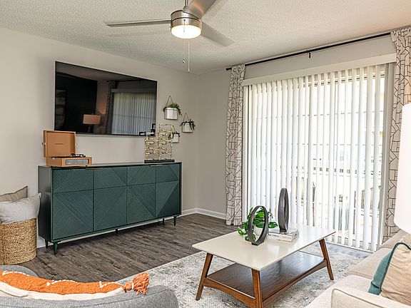 Spacious living room with hardwood-style flooring