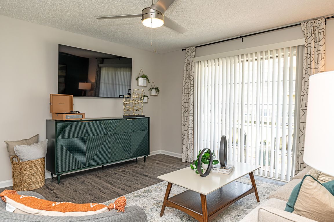 Spacious living room with hardwood-style flooring