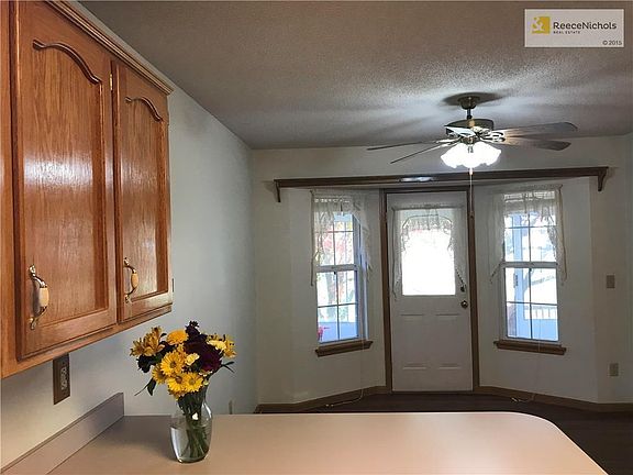 Door leads to the sun room off the kitchen eating area.