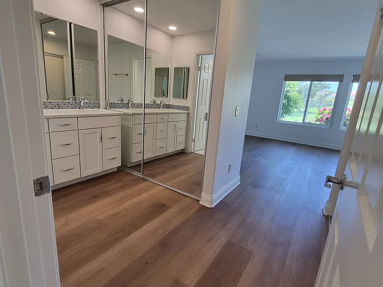 Downstairs primary suite includes all new flooring, remodeled bathrooms, walk-in shower with safety rails. New closets and lots of storage.