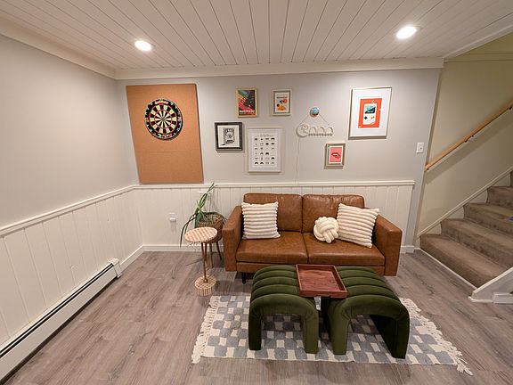 Alternative view of first basement space w/ basement stairs