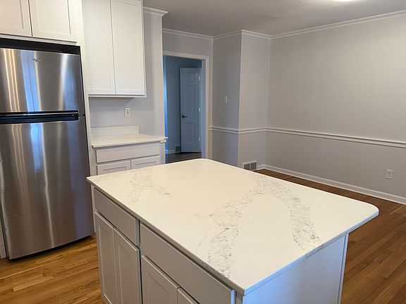 The space off to the right is perfect for a large dining table.
The opening to its left leads into the living room.