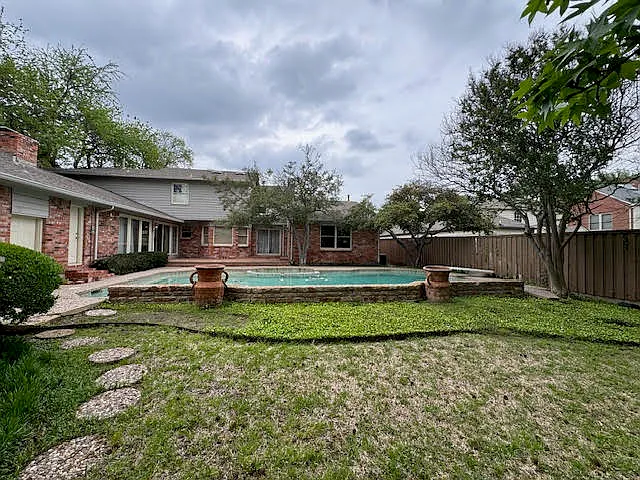 Backyard view. Pool is now fully drained
