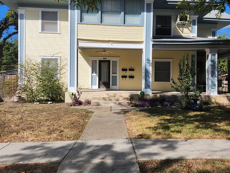 Apartment #2 is located on the left side of the porch