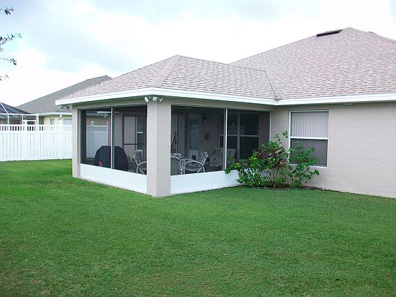 Screened Patio/ Private Fenced Back Yard