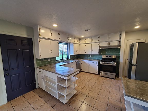 Entering from the backdoor (keyless entry), straight into the open kitchen and dining/living area
