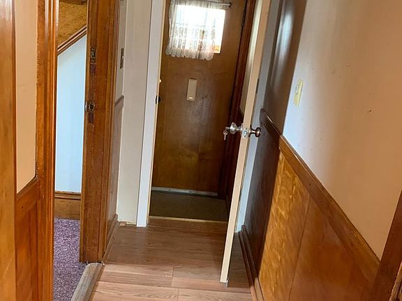 Door to the basement from the first floor, and outside door entrance which has direct access to the basement