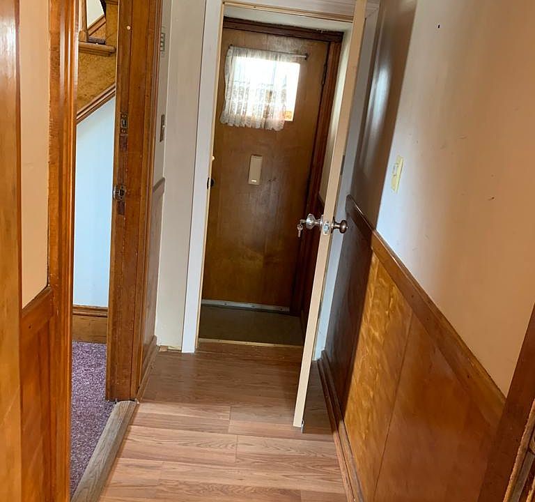 Door to the basement from the first floor, and outside door entrance which has direct access to the basement