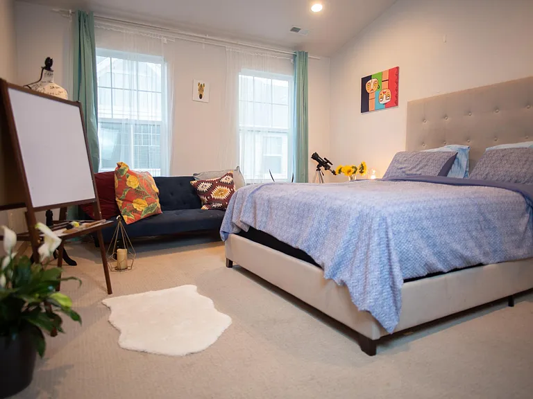 Master bedroom with bed and futon