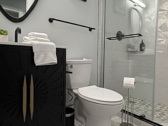 Bathroom with walk-in shower on the main floor. All luxury finishes!