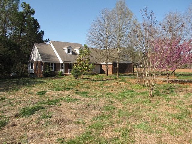 Front of house with large yard