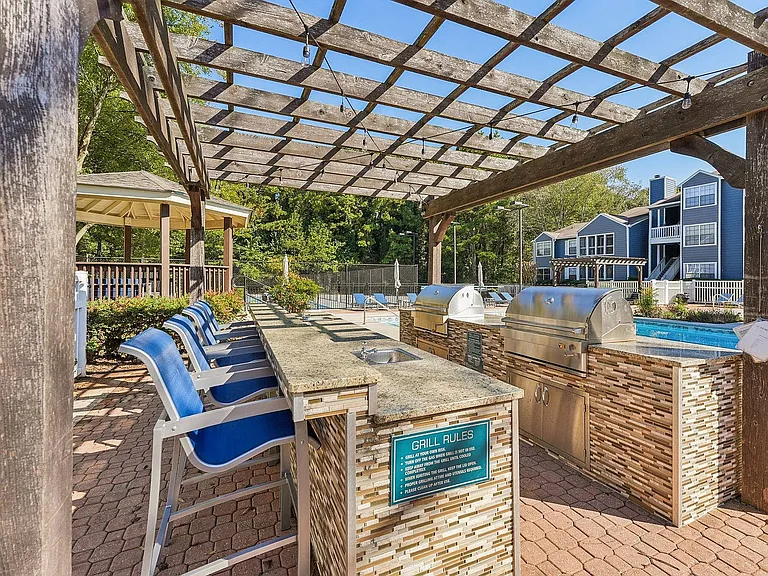 Relax with friends and family at our cozy BBQ and picnic area in Kennesaw