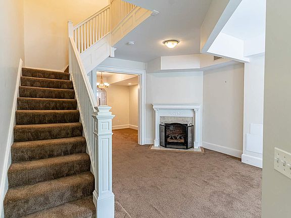 Walking into the house you will see a cozy gas fireplace at one end of the living room.