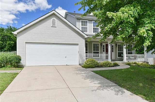 Large 4 bedroom, 2.5 bath, 2 story with laminate wood floors throughout the main level and real hardwood floors throughout the upper level! The home is very light and bright with neutral paint, white trim & crown molding, and light wood floors. The large,
