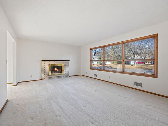 Spacious Living Room has a new electric fireplace